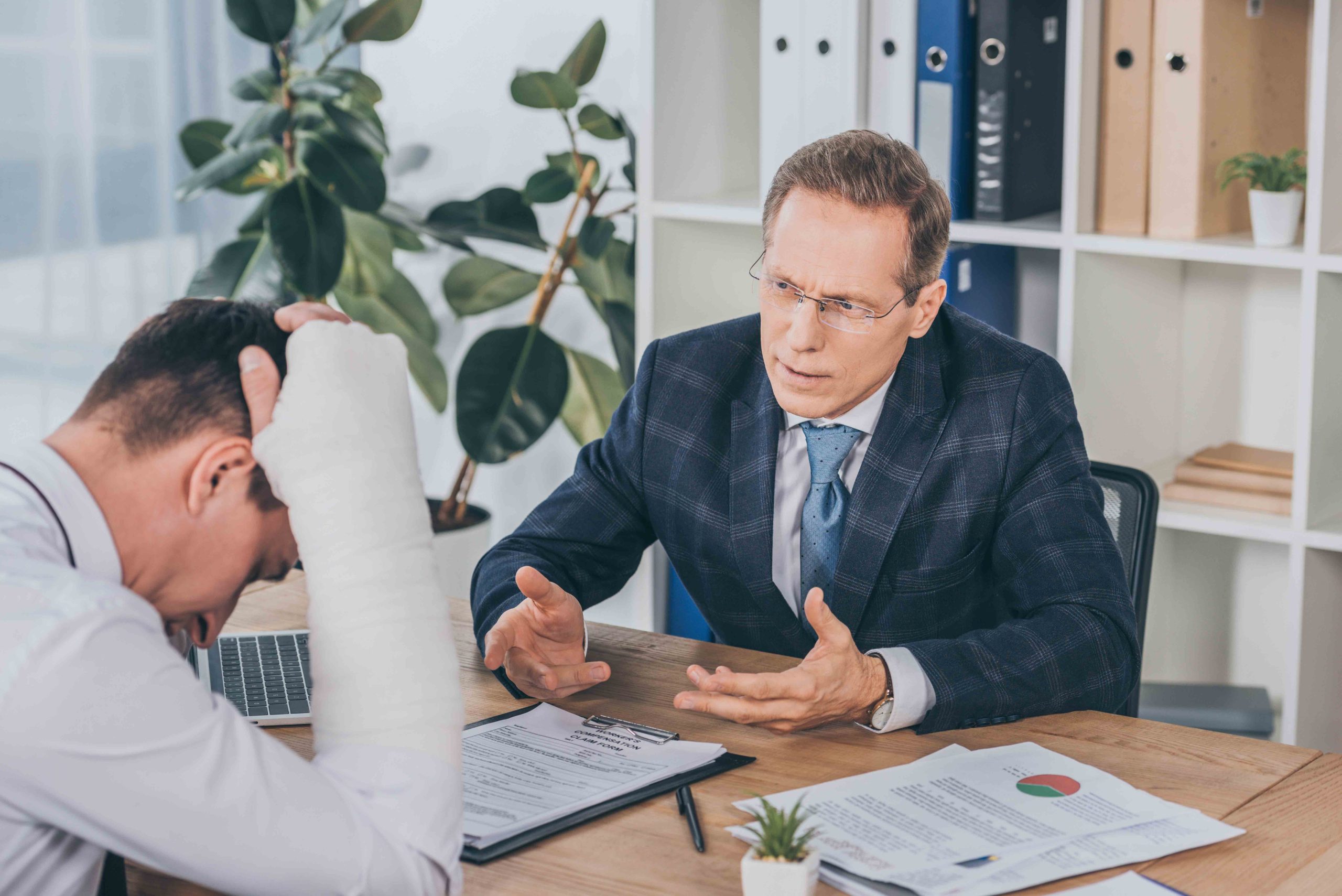 A lawyer consulting with a client about a car accident case