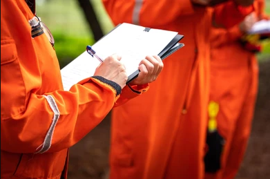 Safety inspector documenting the scene of a construction site accident, focusing on evidence collection to support an injury claim