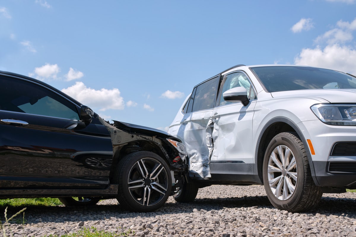 A black SUV crashed to a white SUV, highlighting a recent collision under Texas car insurance laws
