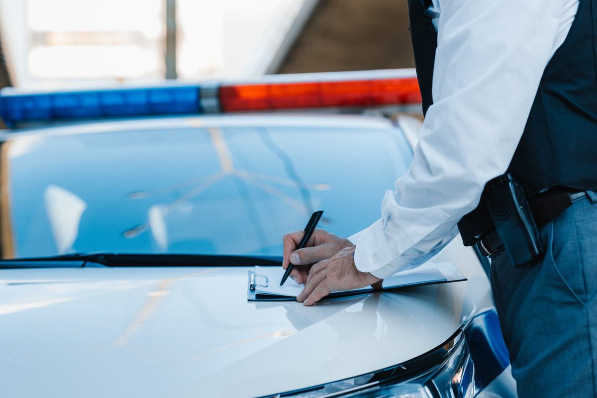 A man in a suit discusses details with an experienced personal injury lawyer regarding a rental car accident injury claim