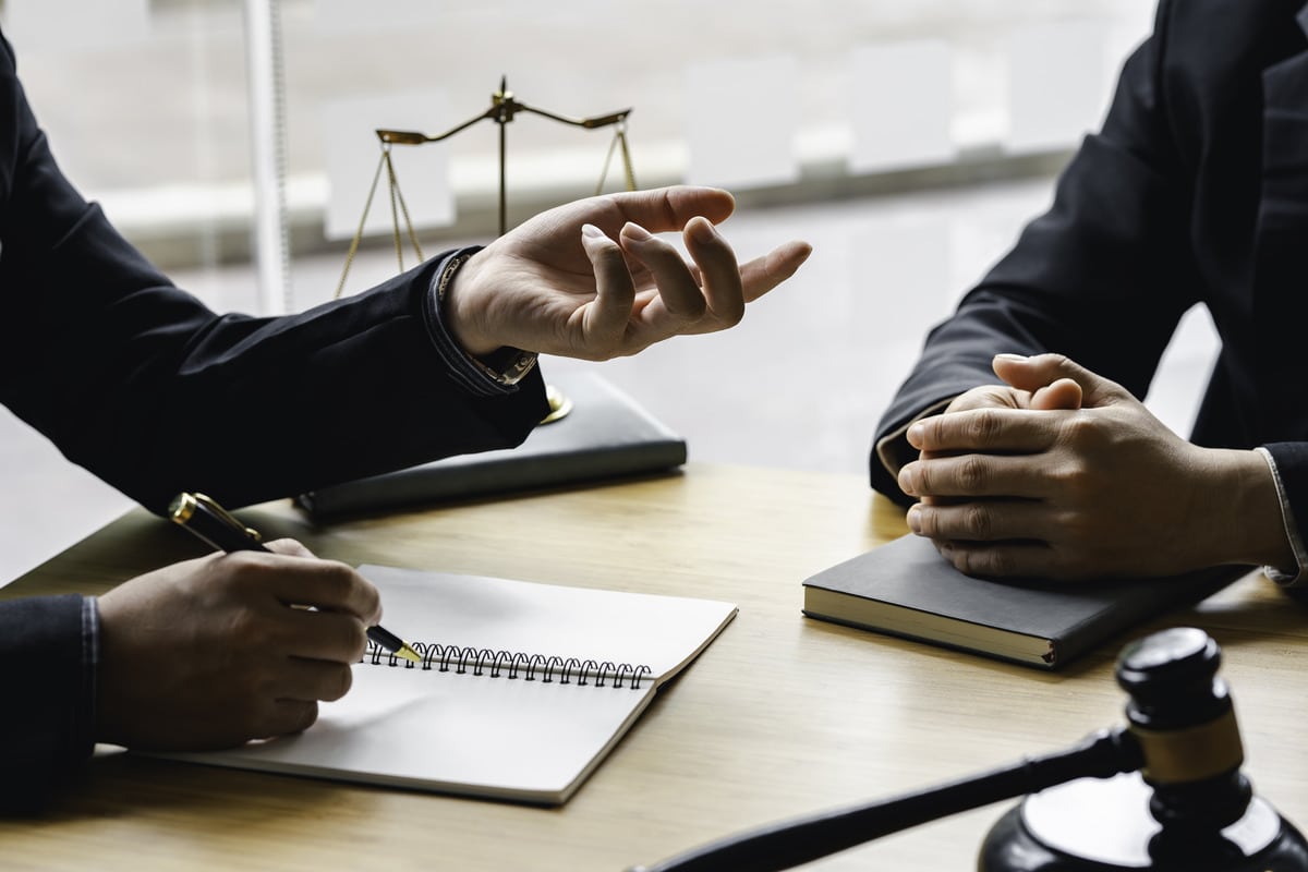 a lawyer discussing the ride-sharing accident injury claim to a client