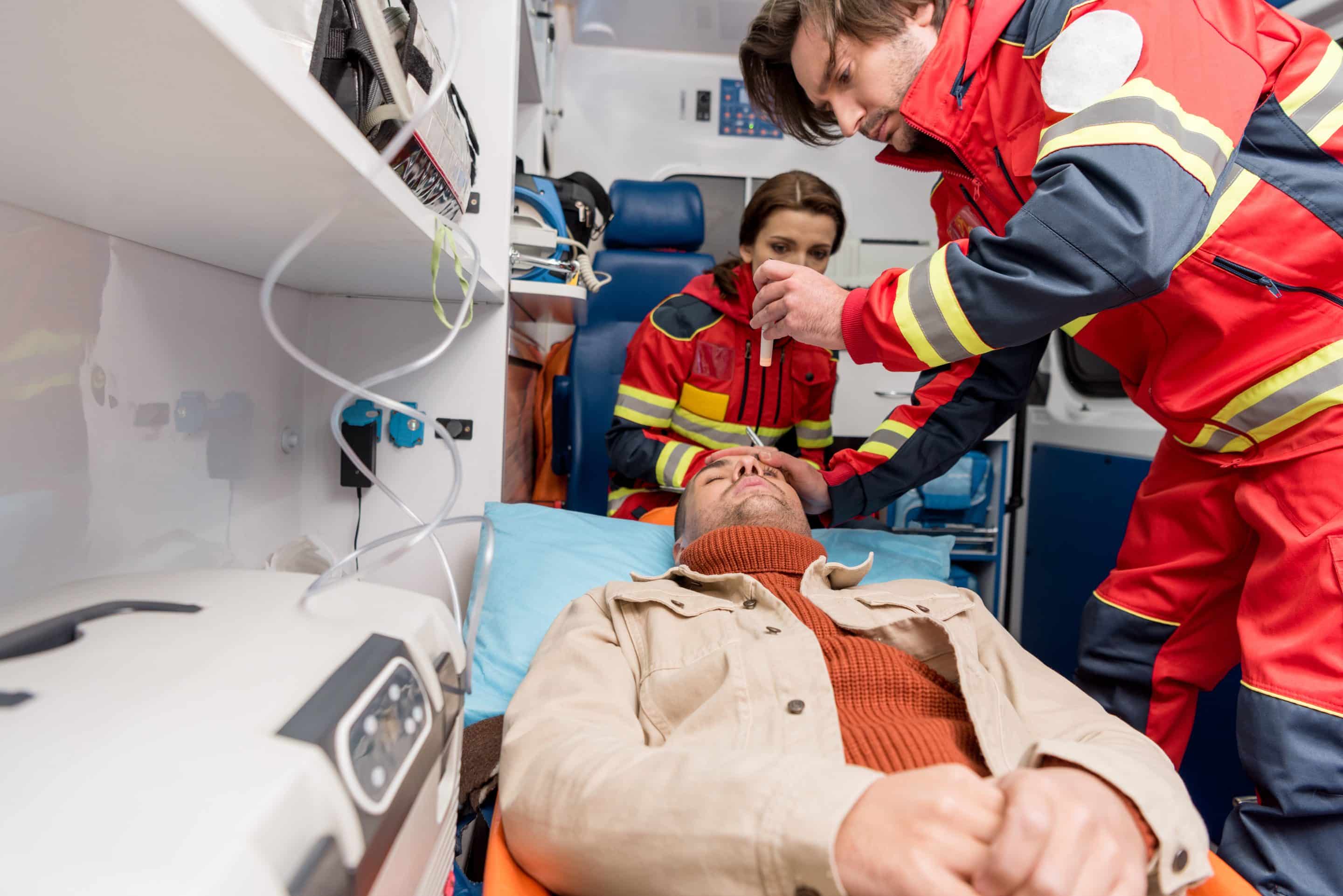 paramedics examining the patient from personal injury
