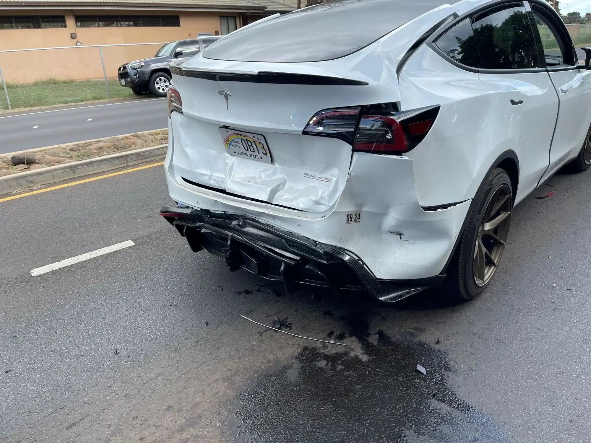 A rear-ended Tesla, a known brand for electric cars