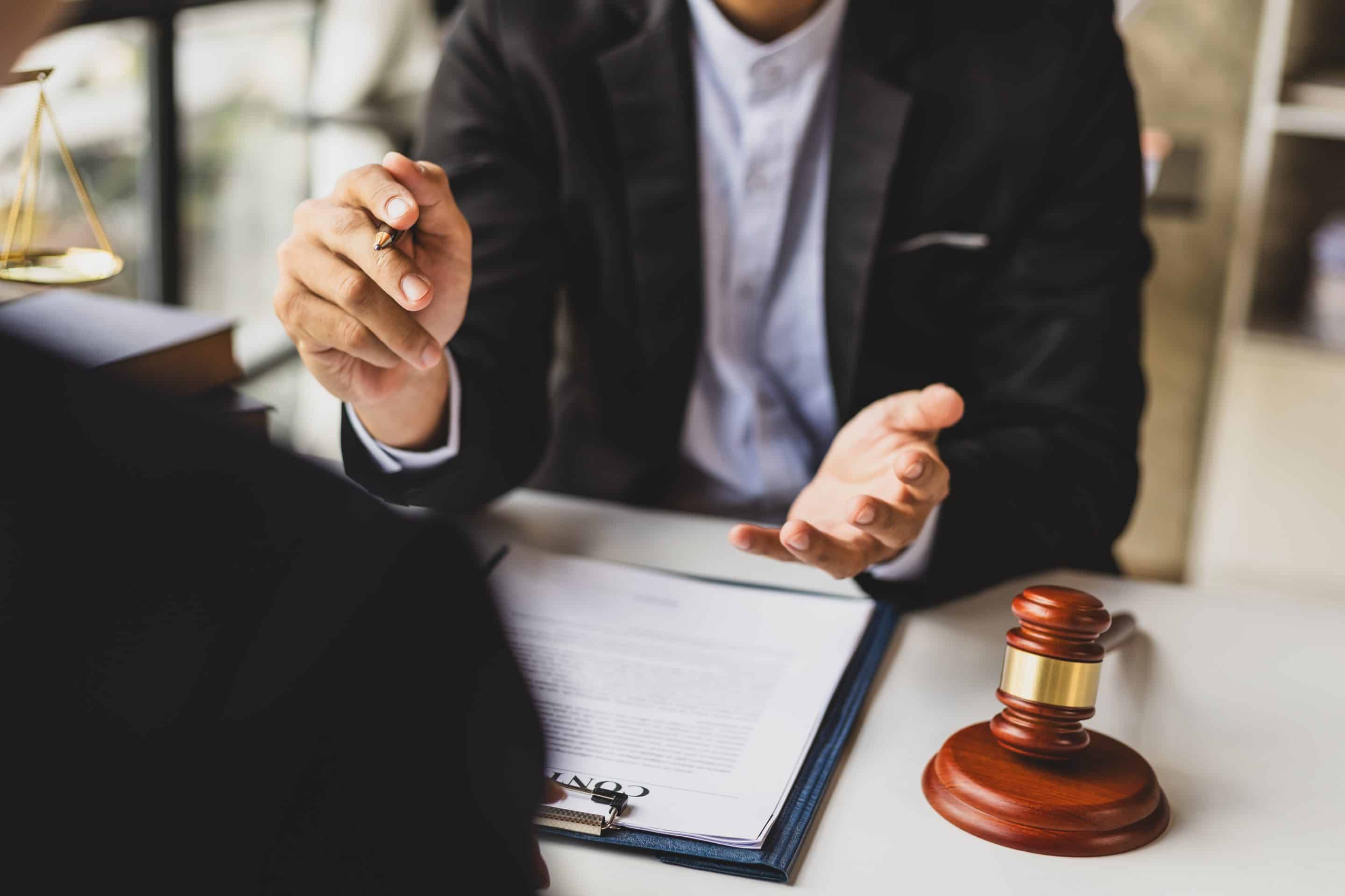 Lawyer talking to a client about the electric car accident