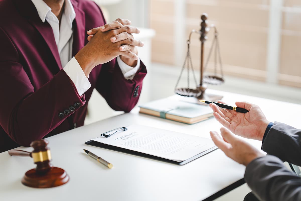 A lawyer and client discussing how to handle maintenance related cases