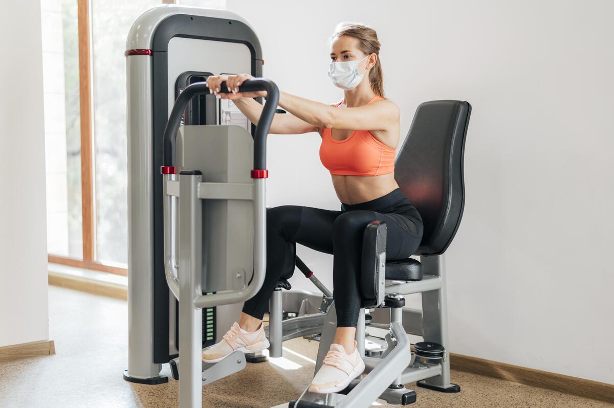 Close-up of a gym treadmill screen displaying a “Danger: Out of Order” sign, indicating equipment maintenance or malfunction