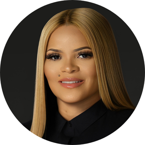 Hand checking off items on a handwritten checklist in a notebook with a black pen